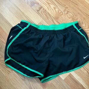 Nike Black and Green Athletic Shorts with Curved Hems